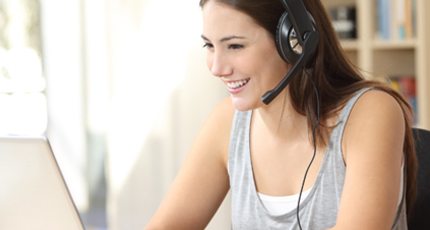 Female mentee standing in front of a door